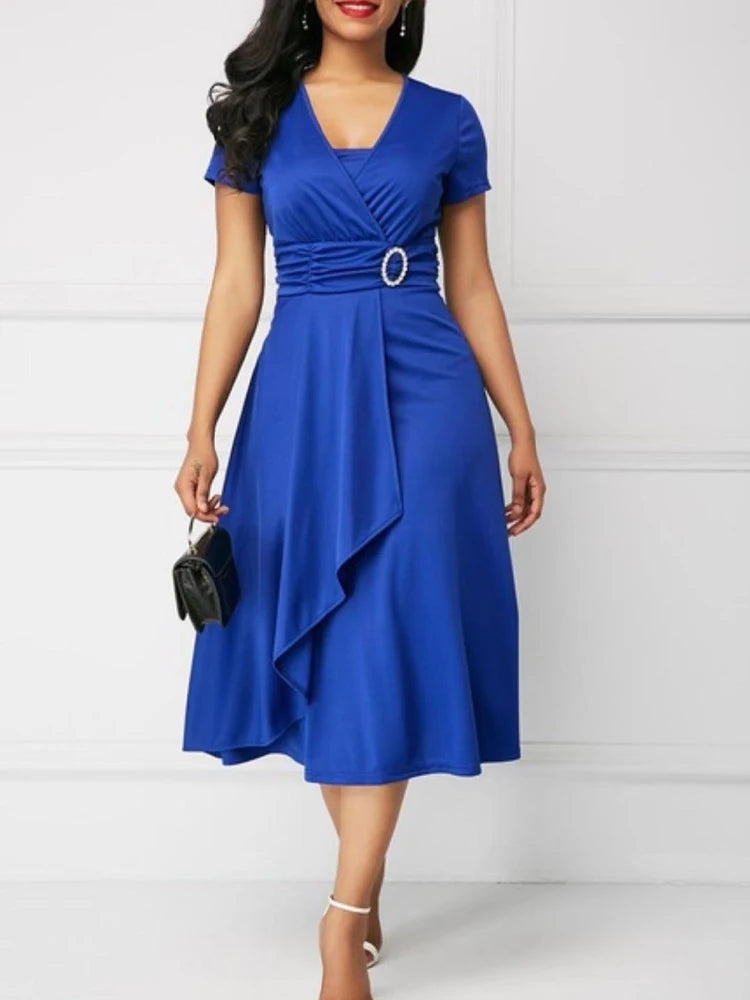 Woman wearing a blue dress with a white background