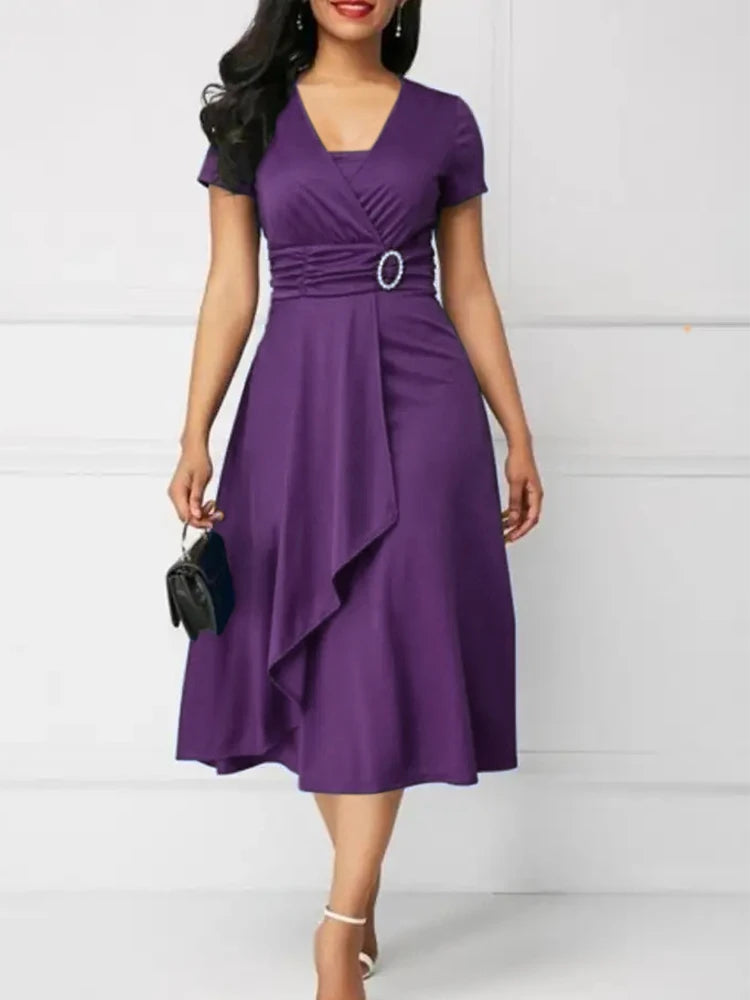 Woman wearing a purple dress with a white background