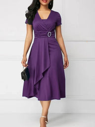 Woman wearing a purple dress with a white background