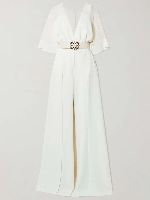 White dress with a gold belt on a light gray background