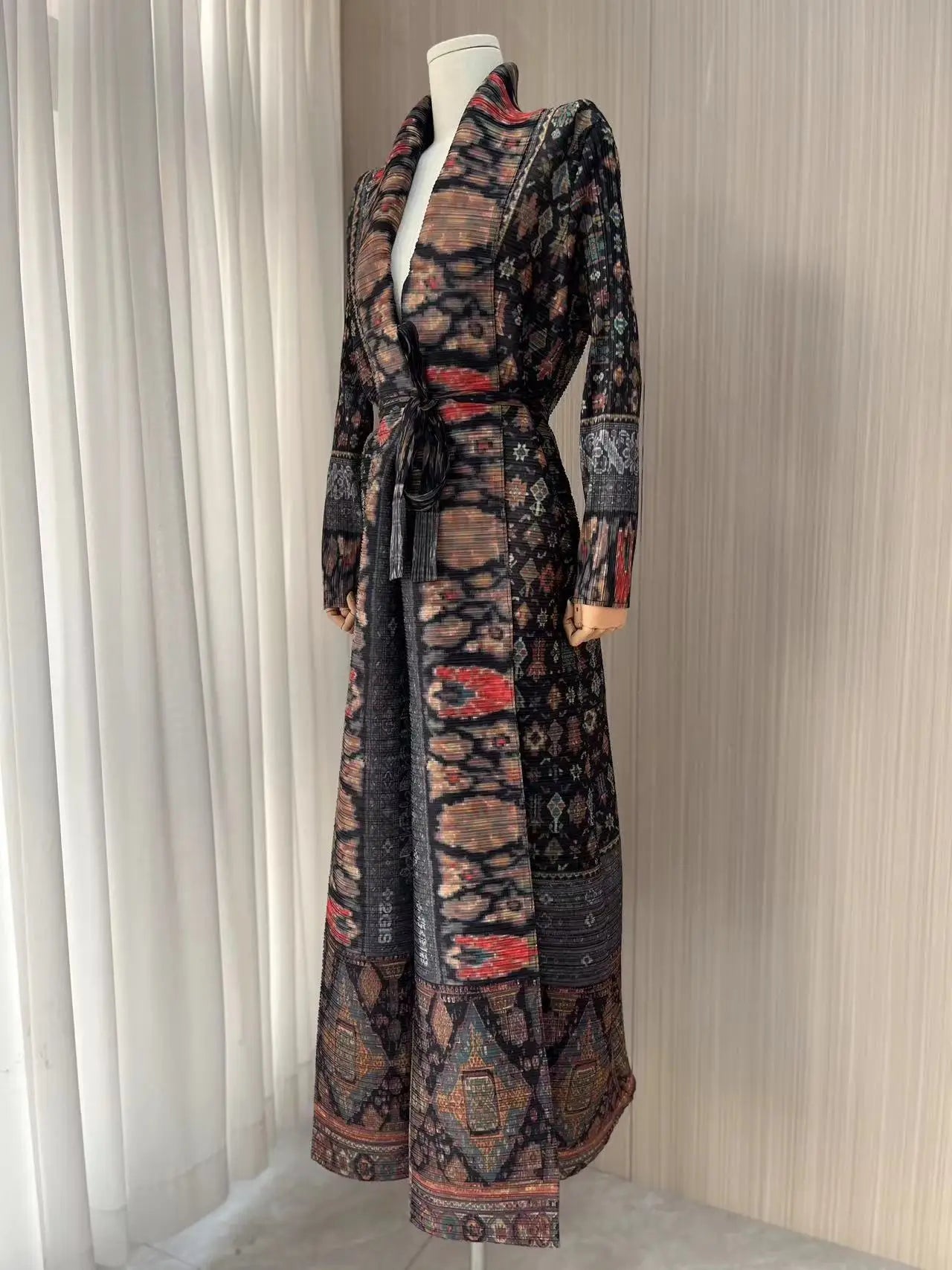 Bold pleated coat with artistic design