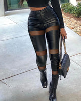 Mesh-insert PU pants styled with crop top