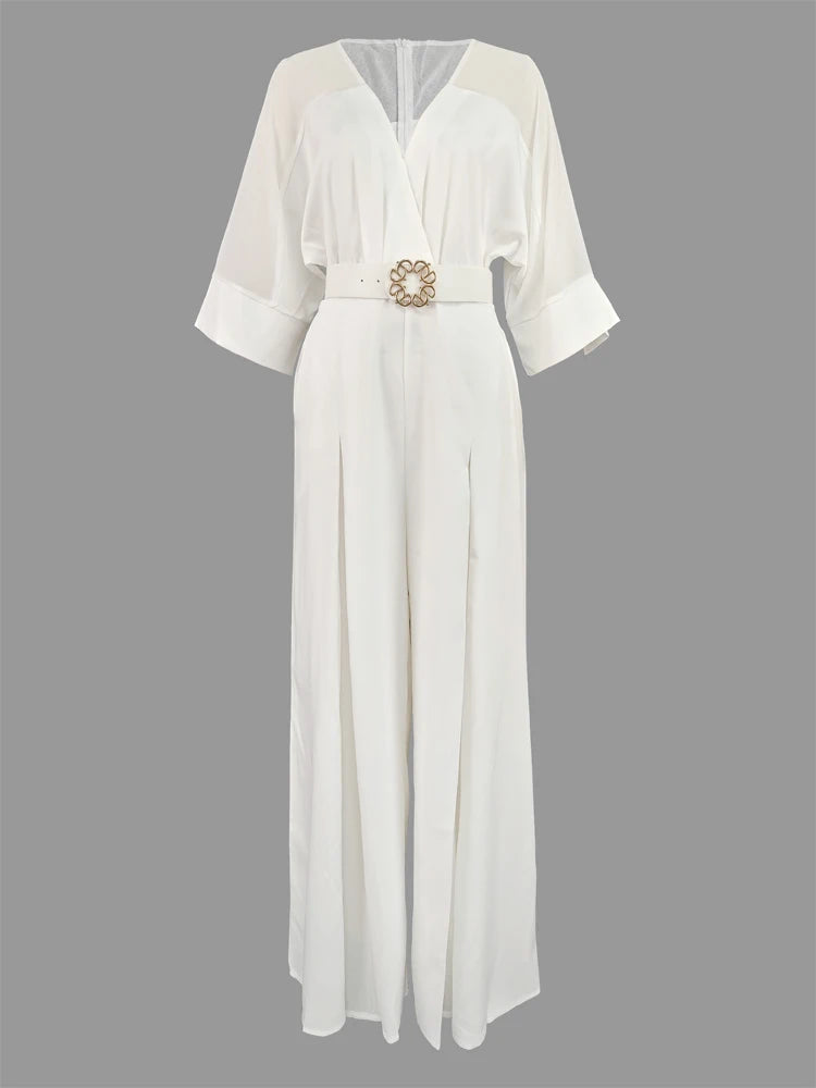 White dress with a belt on a gray background