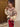 A woman wearing an oversized sweater with a geometric jacquard pattern in multicolor.