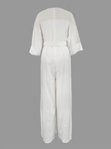 White jumpsuit on a gray background