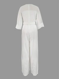 White jumpsuit on a gray background