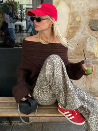 Solid-color knit sweater shoulder detail