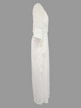 White dress with a belt on a gray background