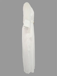 White dress with a belt on a gray background